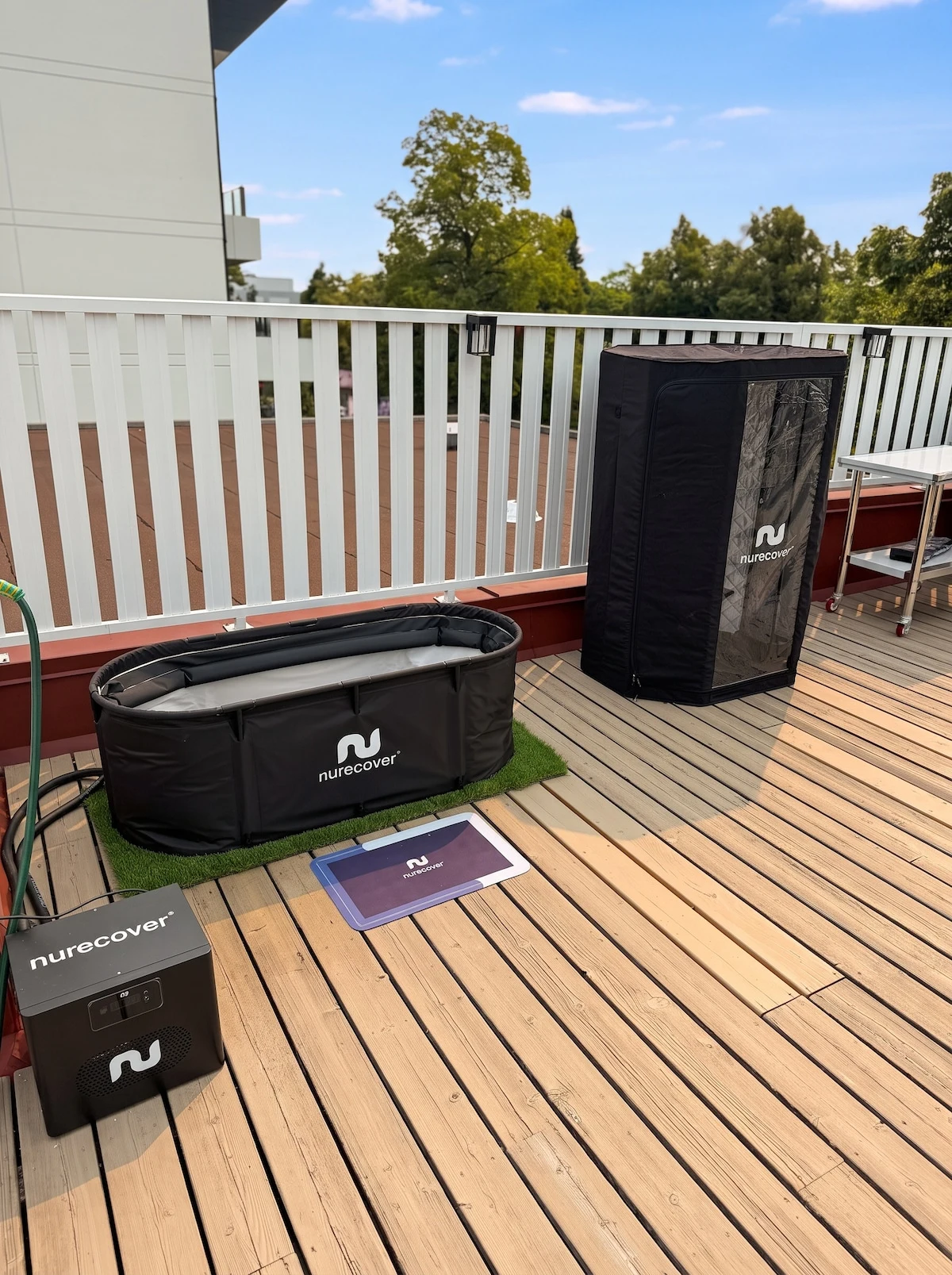 Nurecover cold plunge tub and portable sauna on the rooftop